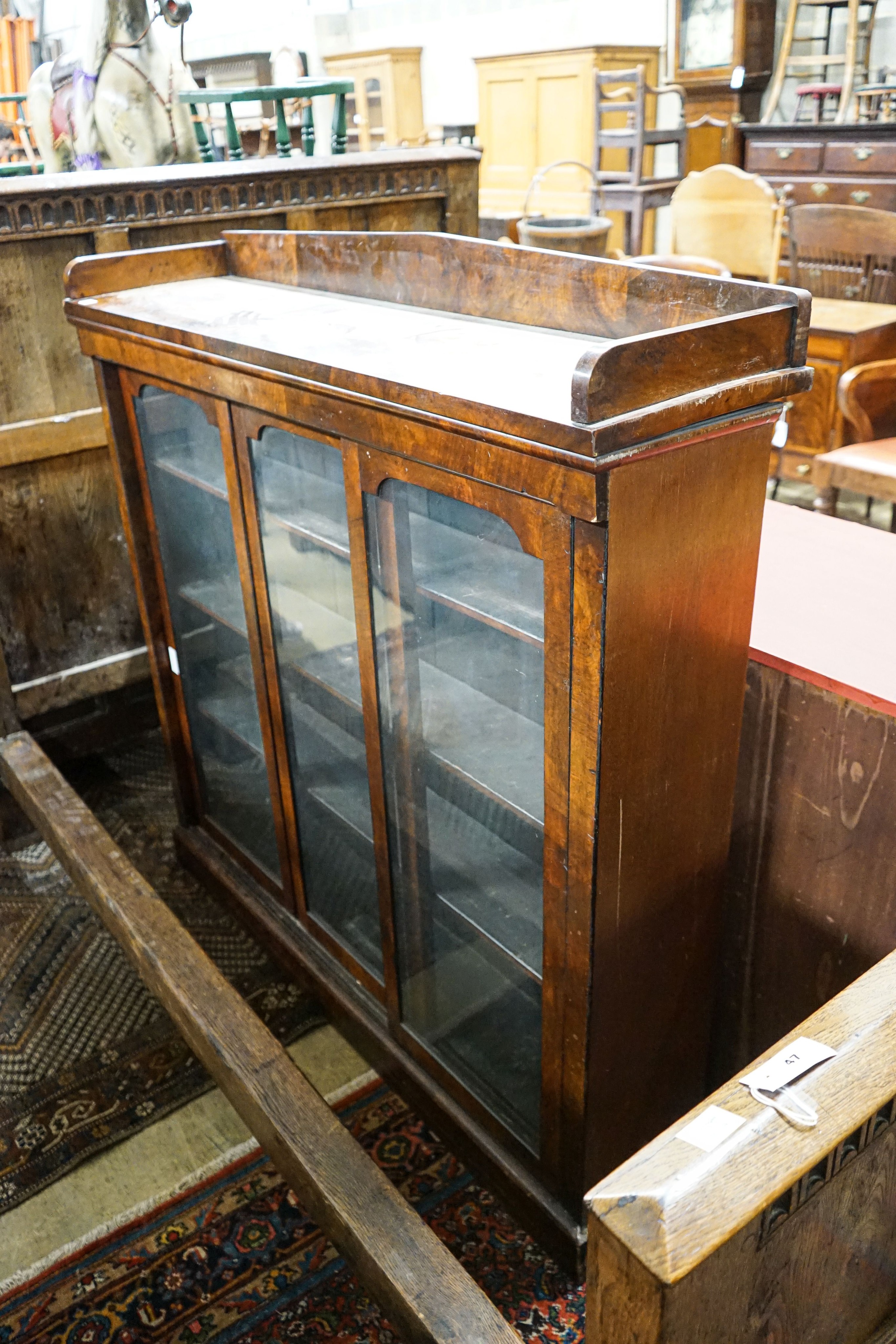 A Victorian mahogany sliding door glazed bookcase, length 130cm, depth 33cm, height 134cm
